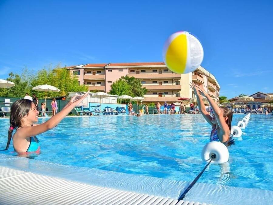 Seasonal outdoor pool, open 10:00 AM to 8:00 PM, pool umbrellas