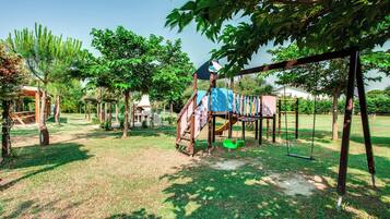 A playground with swings, slides, and climbing structures.