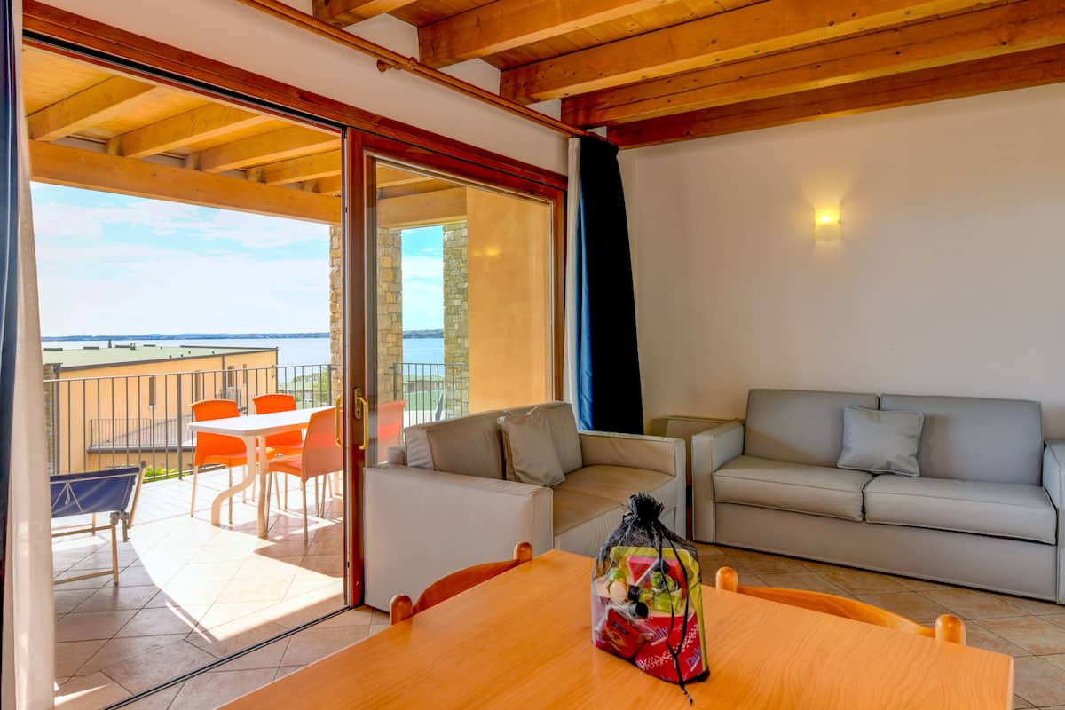 Standard Apartment, 1 Bedroom | Living area | Flat-screen TV, DVD player