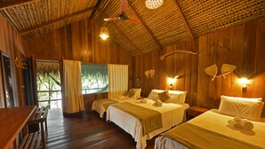 A wooden room with two beds, a bench, and a table. - Juma Amazon Lodge (Autazes)