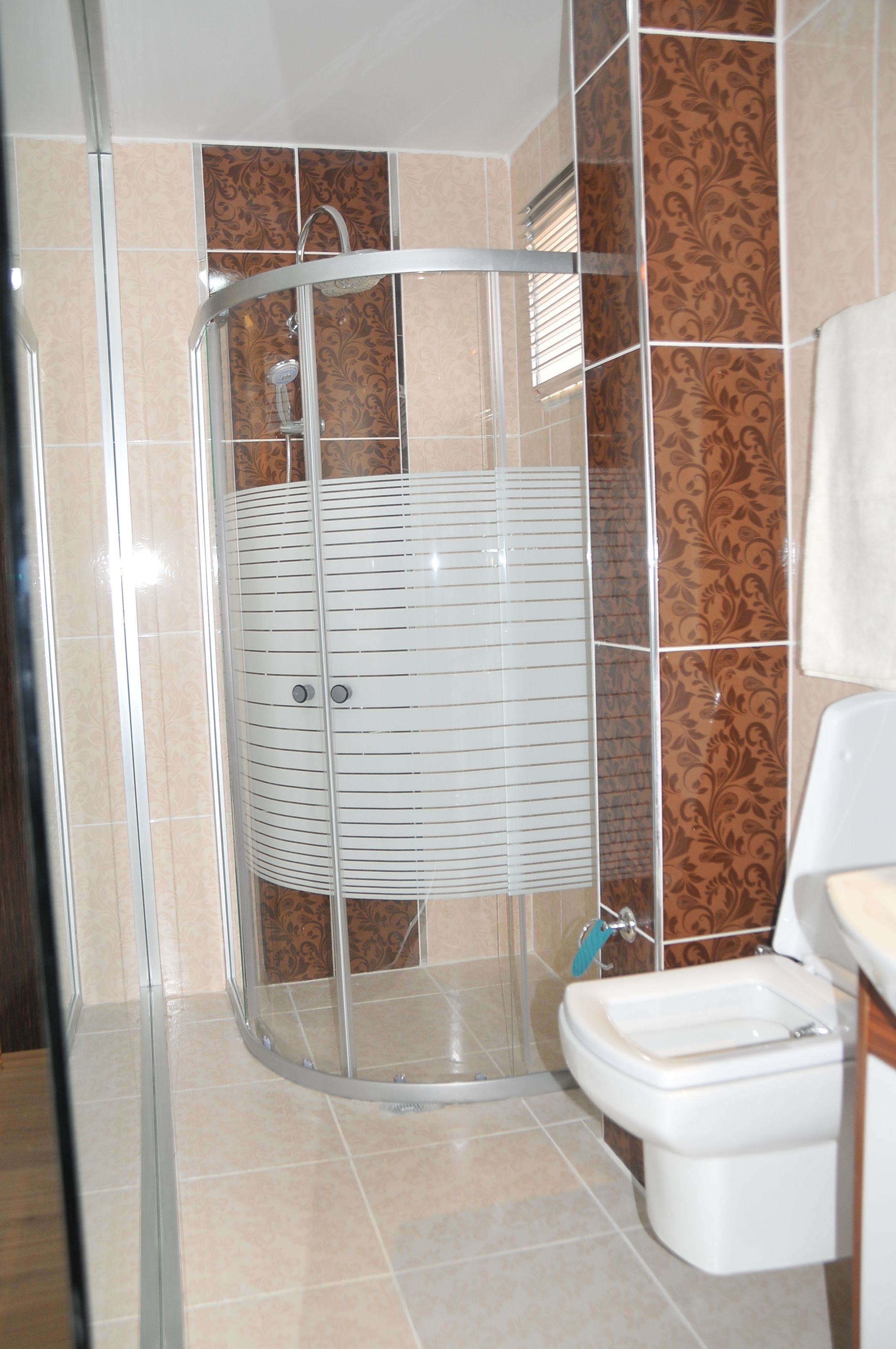 combined shower/bathtub, eco-friendly toiletries, hair dryer, bathrobes