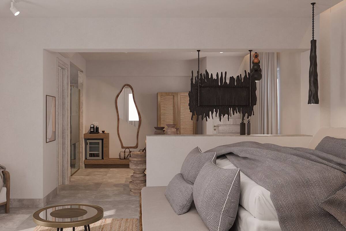 Un dormitorio moderno con una cama grande, una mesita redonda y vistas al baño.