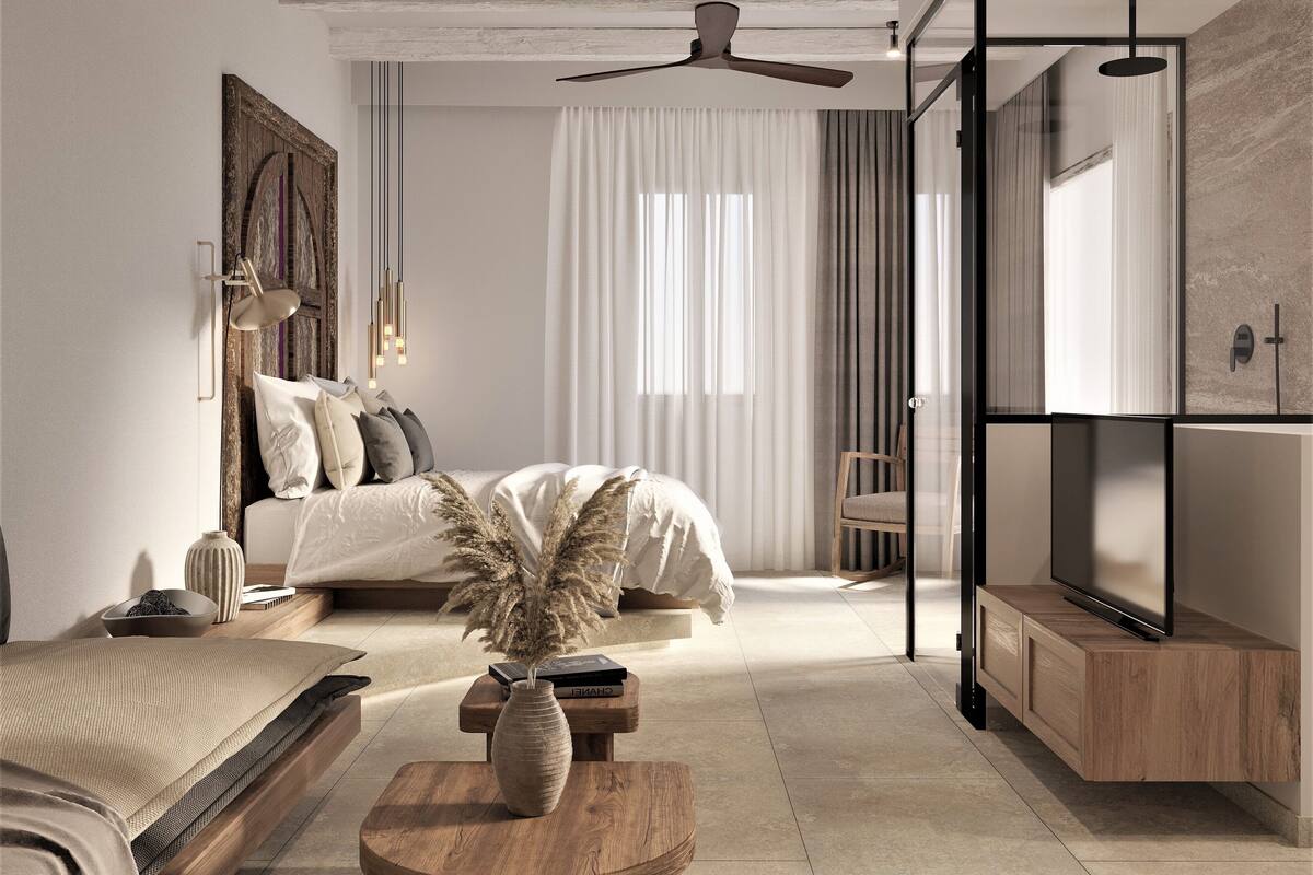 Un dormitorio moderno con cama, mesita de noche y televisor.