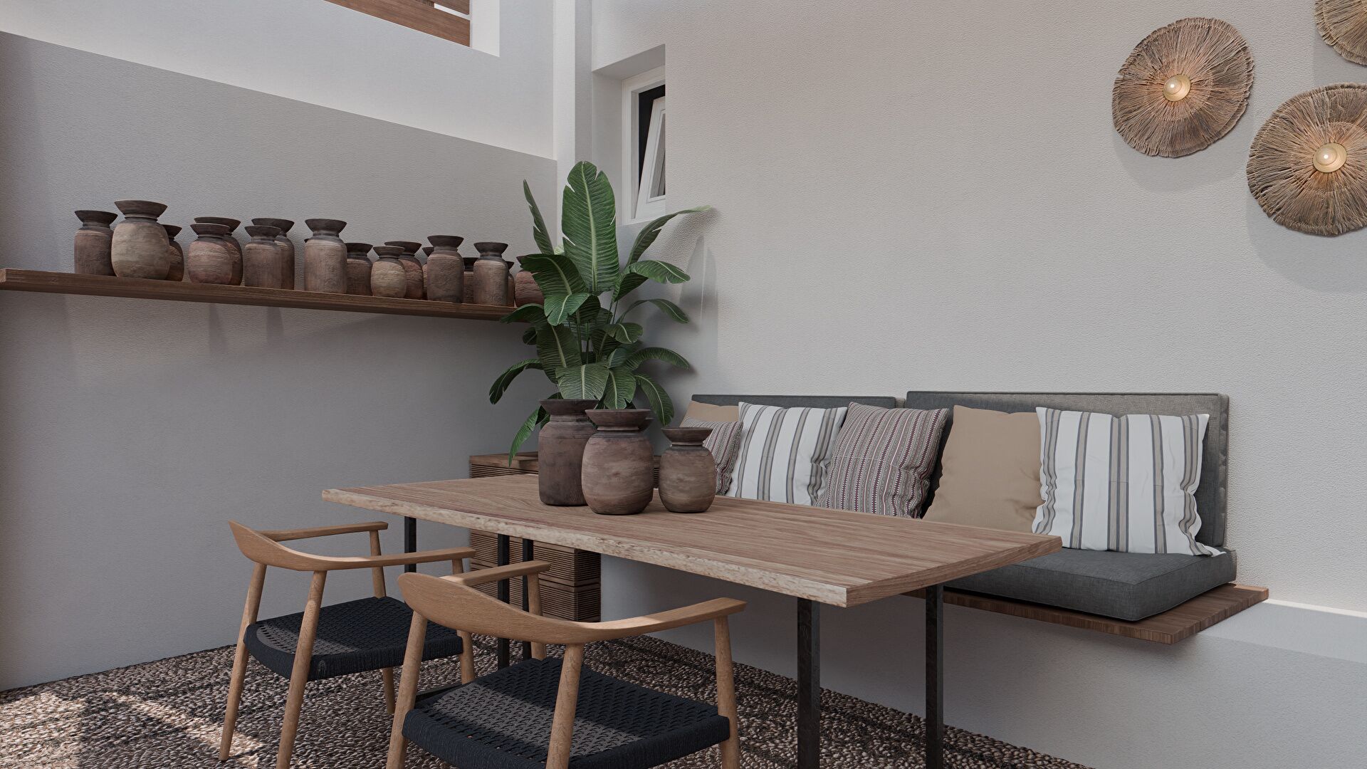 A modern dining area with a wooden table and chairs, a potted plant, and a sofa with cushions.