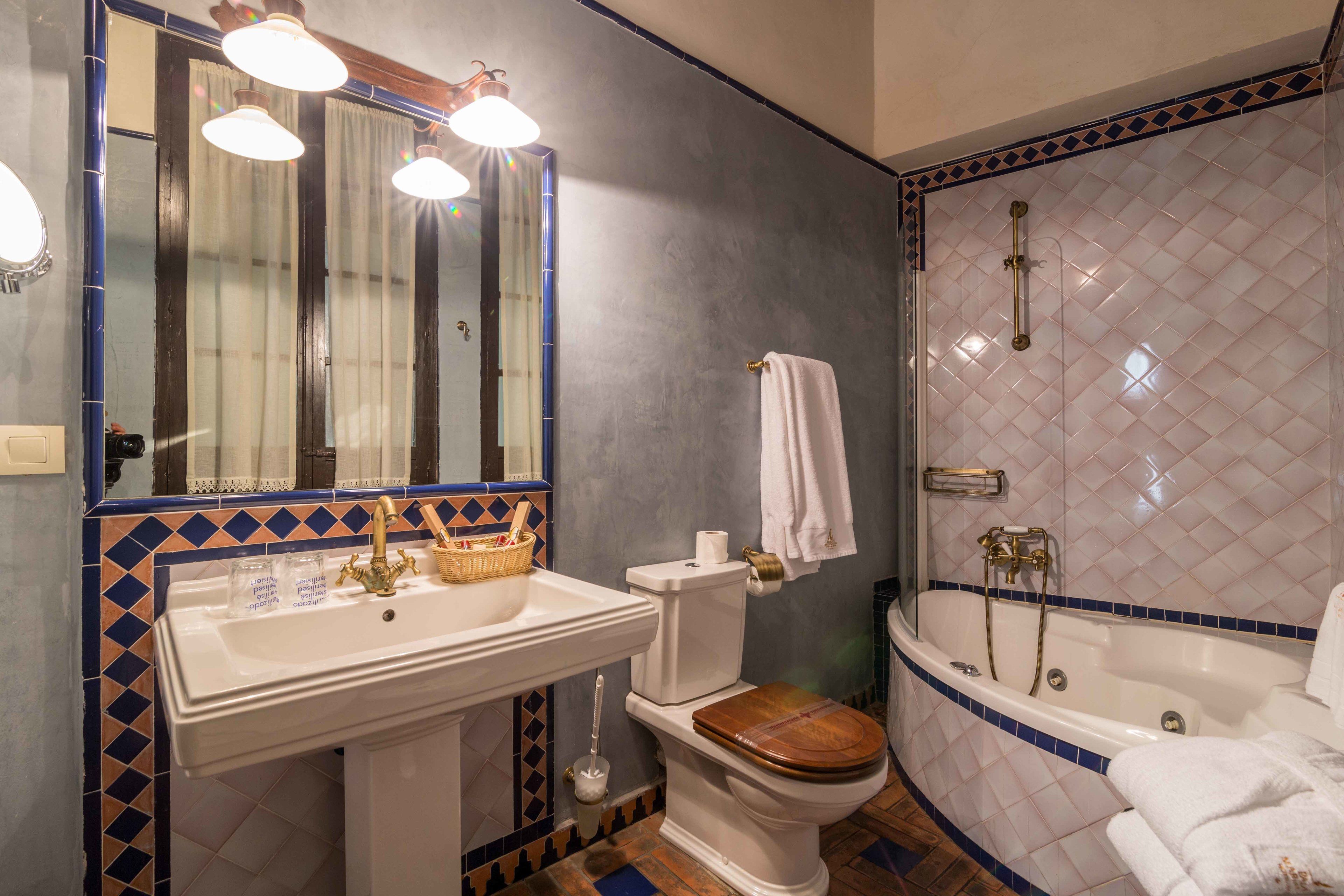 junior suite (alhambra) | bathroom | hair dryer, bathrobes, slippers, towels