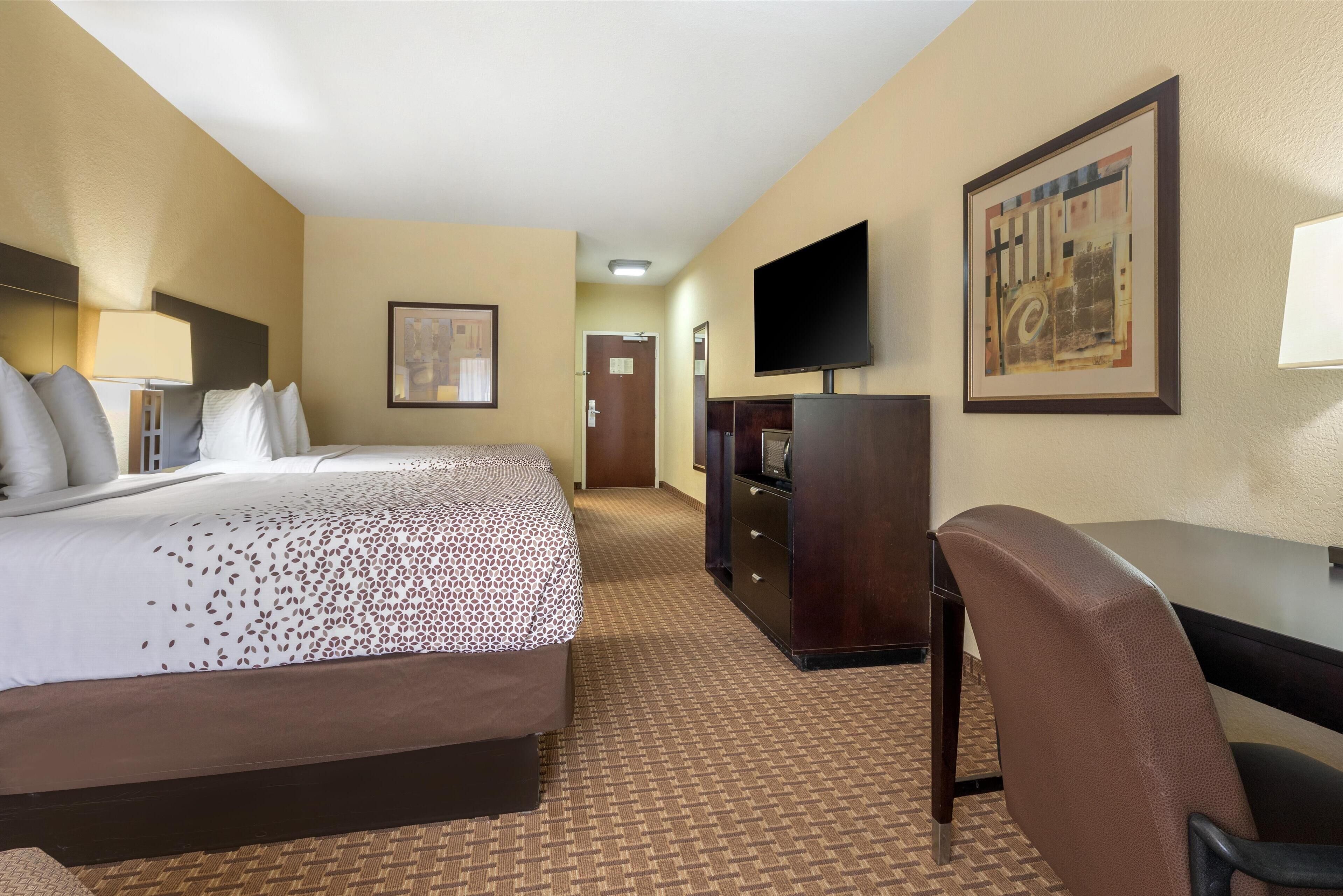 standard room, 2 queen beds, non smoking, refrigerator & microwave | pillow-top beds, in-room safe, desk, laptop workspace