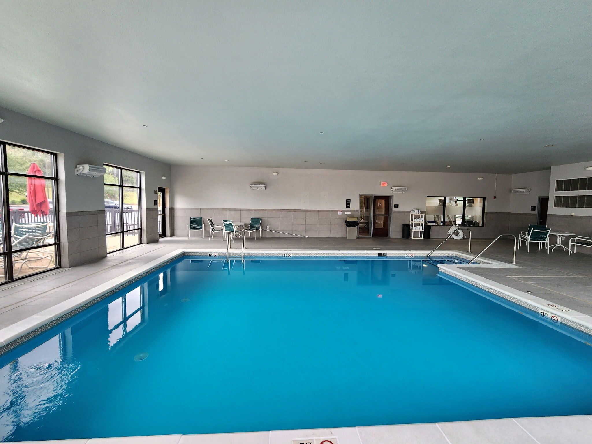 Indoor pool, open 8 AM to 10 PM, pool loungers