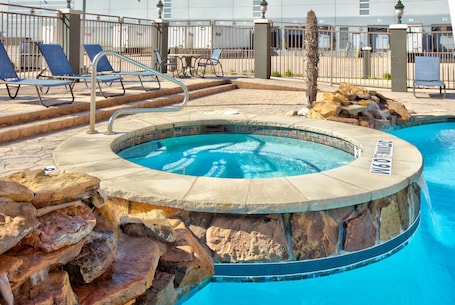 Outdoor pool. La Quinta Inn & Suites by Wyndham Dallas Grand Prairie South