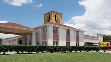 Classic hotel building with a symmetrical facade and central tower.