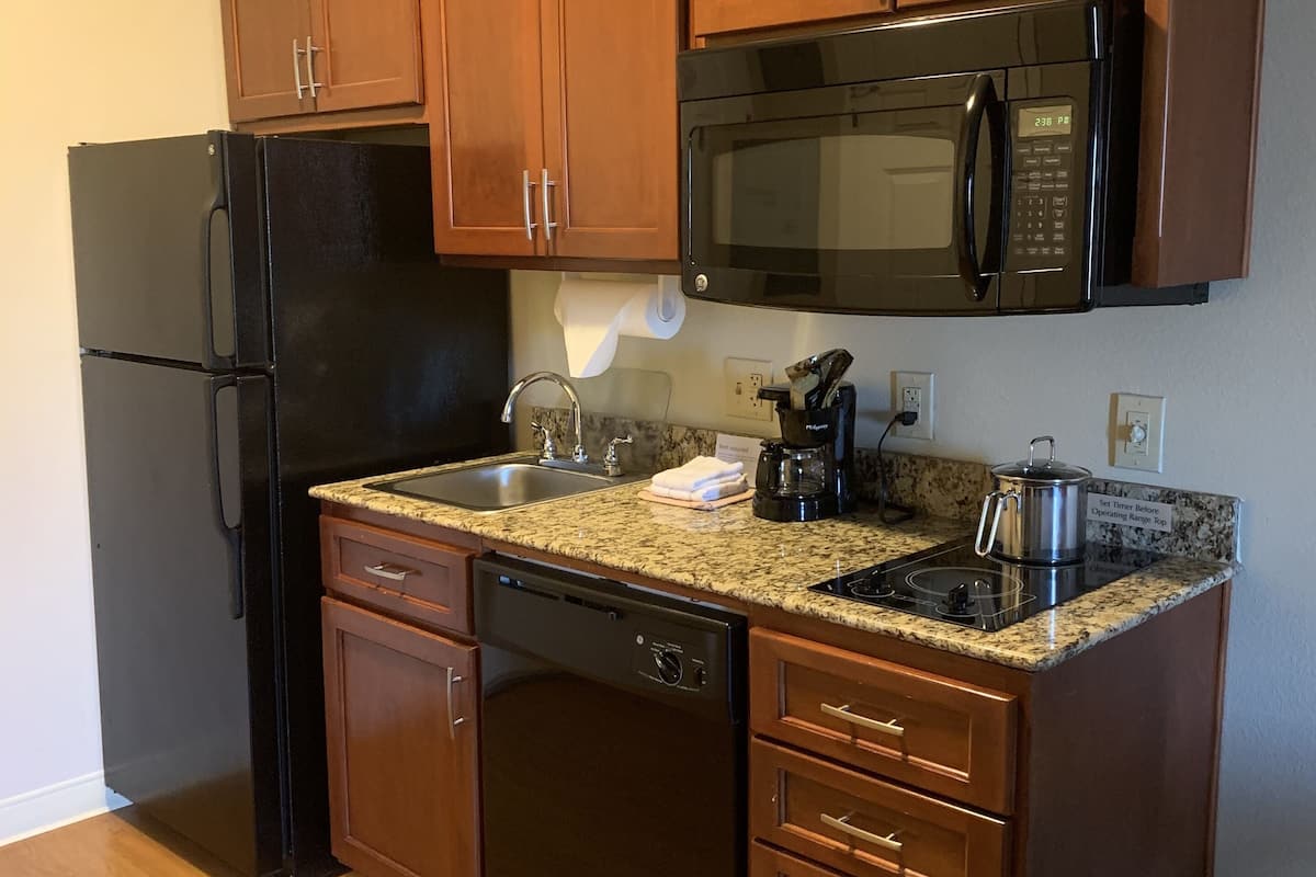 full-sized fridge, microwave, stovetop, dishwasher