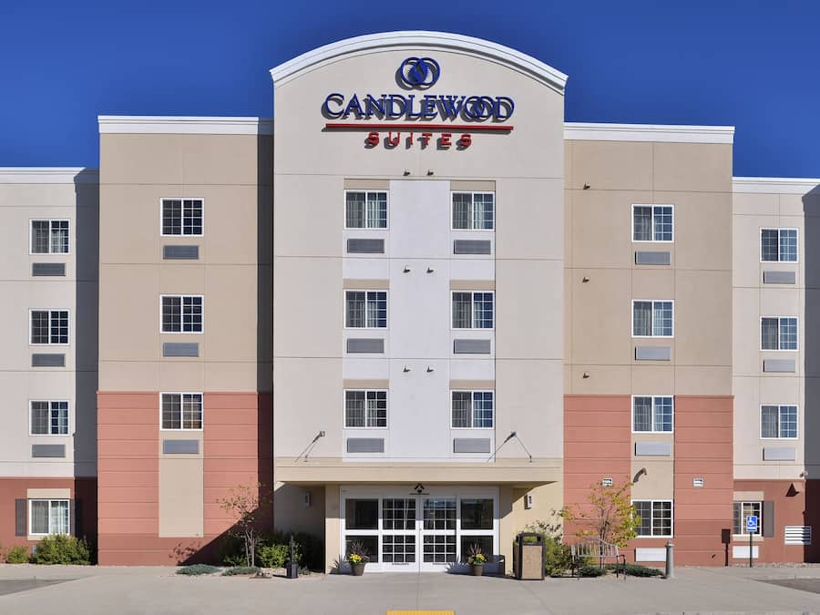 A multi-story hotel with a prominent signage for Candlewood Suites.