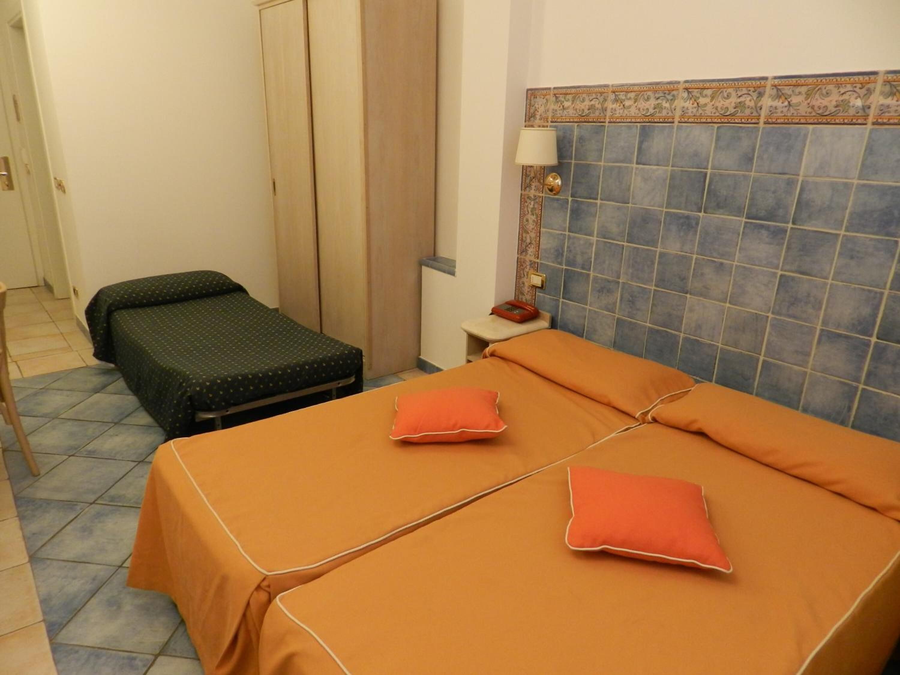 standard triple room | in-room safe, desk, iron/ironing board, free cots/infant beds