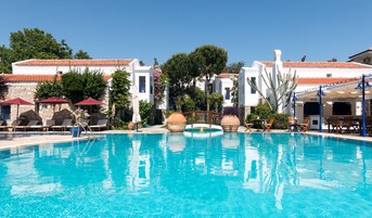 2 outdoor pools, pool umbrellas, pool loungers