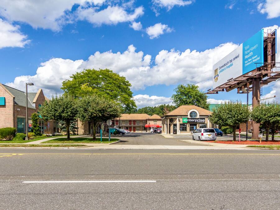 A street view with a bank, a children's hospital, and a store.