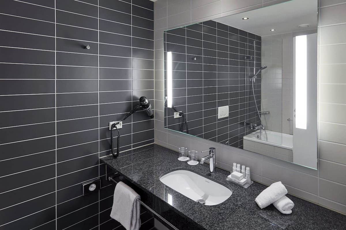 Shower, eco-friendly toiletries, hair dryer, bathrobes