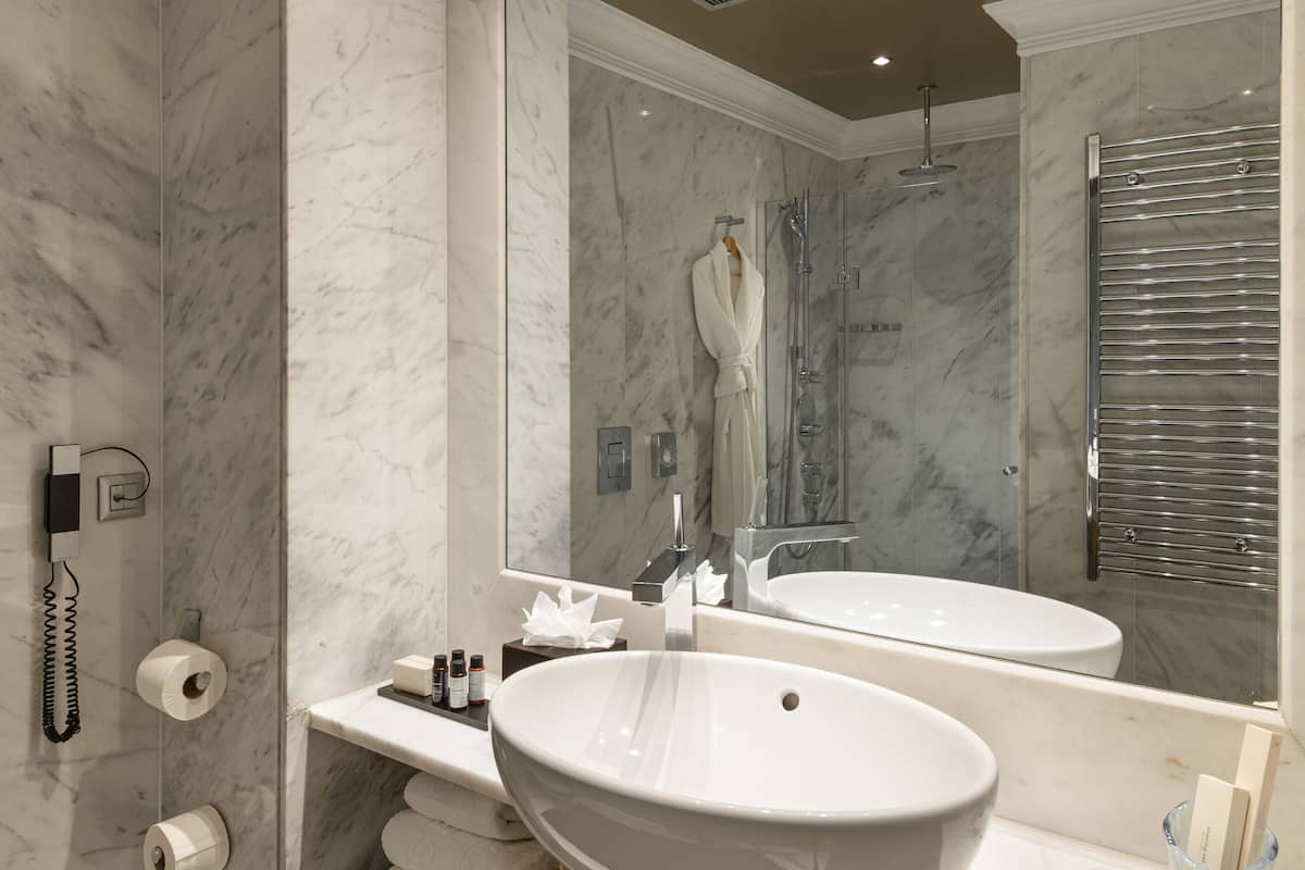 classic room | bathroom | designer toiletries, hair dryer, bathrobes, slippers