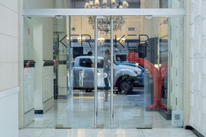 A glass door entrance with the text "KRECKER" visible. - Ker Recoleta Hotel (Buenos Aires)