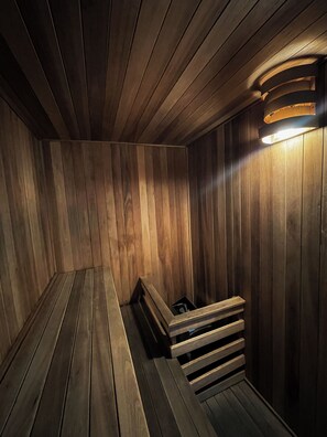 A sauna with wooden walls and benches. - Ker Recoleta Hotel (Buenos Aires)
