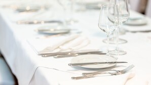 A table set with white tablecloths, silverware, and clear glassware. - Hotel Rheinfelderhof (Basel)
