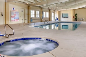 Indoor pool, open 8:00 AM to 10:00 PM, pool loungers