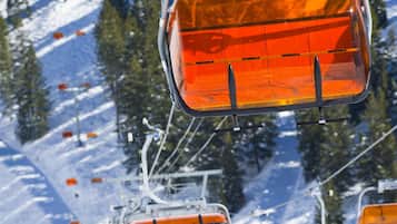 A ski lift chair with passengers.