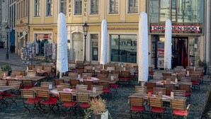 A hotel with a classic European facade, outdoor seating area, and a modern glass extension. - Aparthotel Altes Dresden (Dresden)
