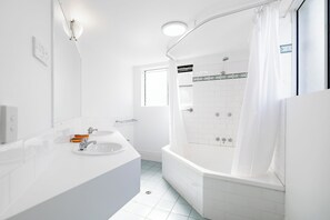 Upper Queen Twin | Bathroom | Designer toiletries, hair dryer, towels