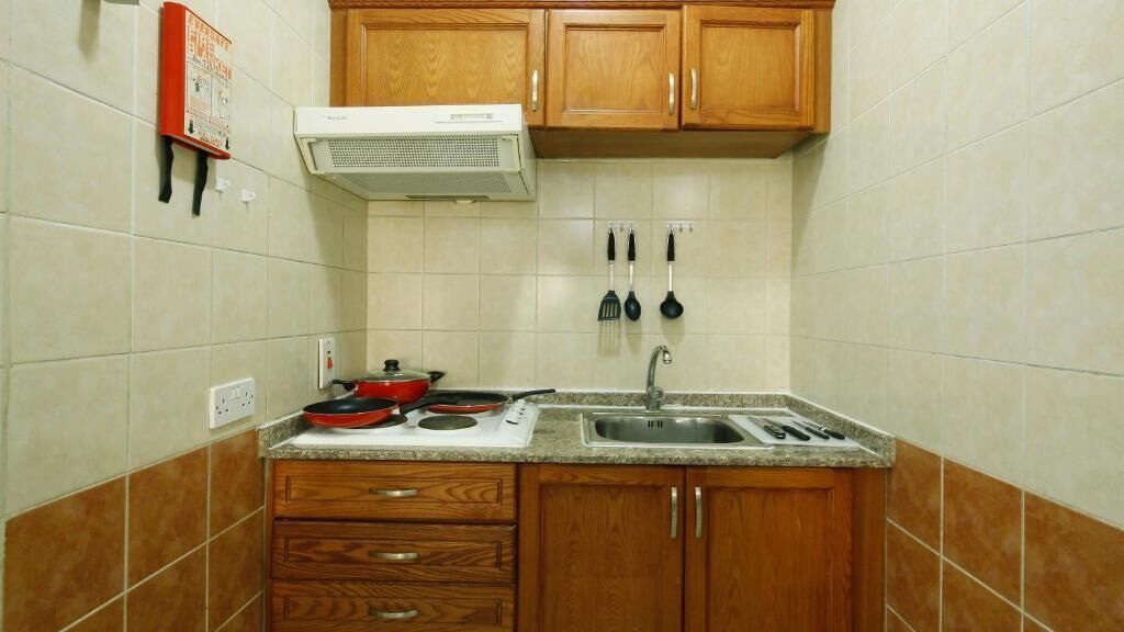 full-sized fridge, microwave, stovetop, coffee/tea maker