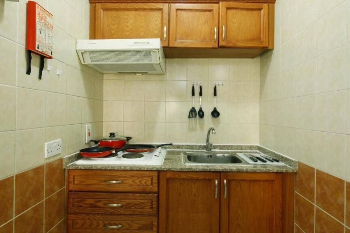 full-sized fridge, microwave, stovetop, coffee/tea maker