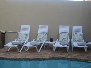 Outdoor pool, open 8:00 AM to 8:00 PM, pool umbrellas, pool loungers