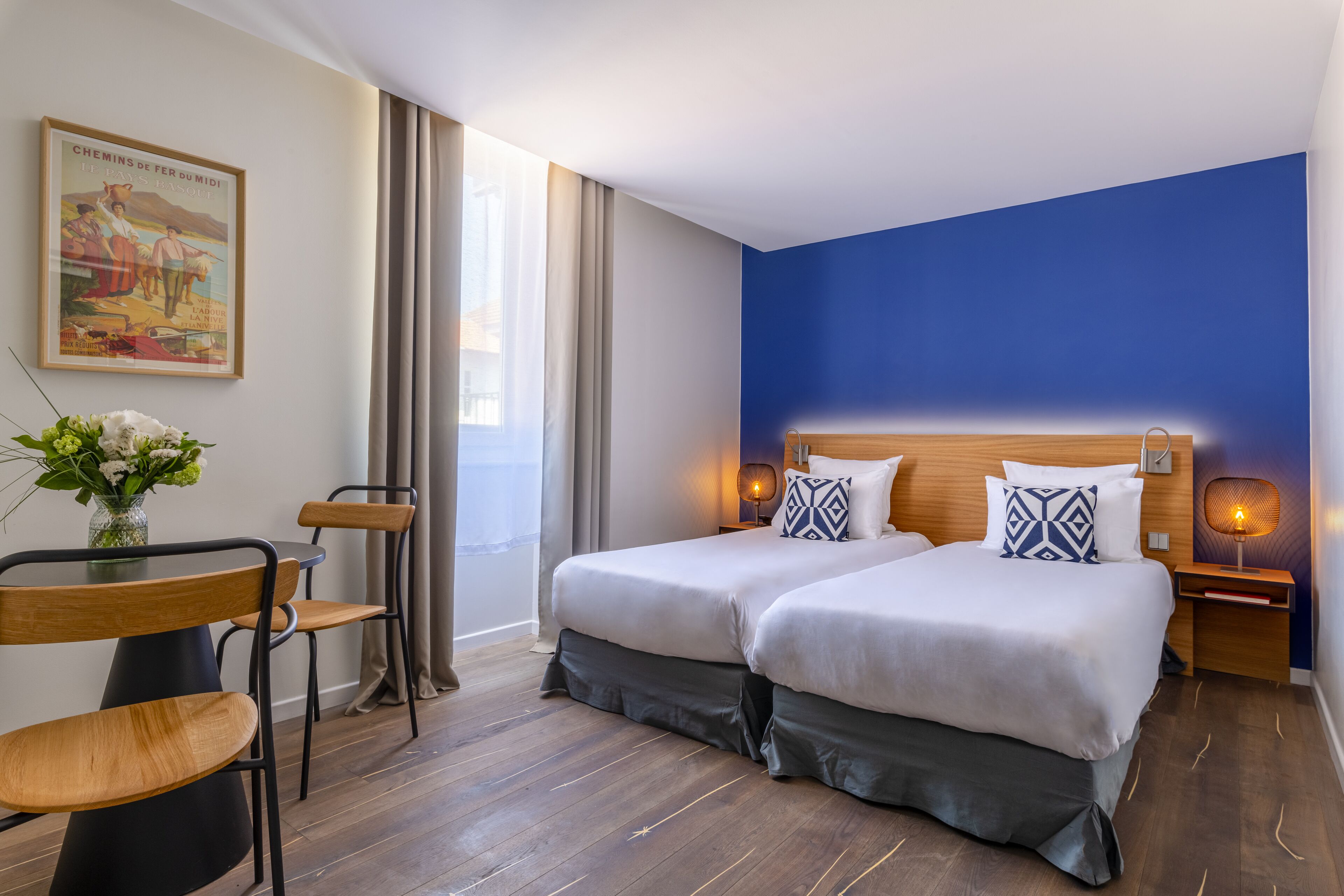 luxury room | premium bedding, desk, blackout curtains, soundproofing