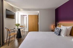 Luxury Room | Premium bedding, desk, blackout drapes, soundproofing