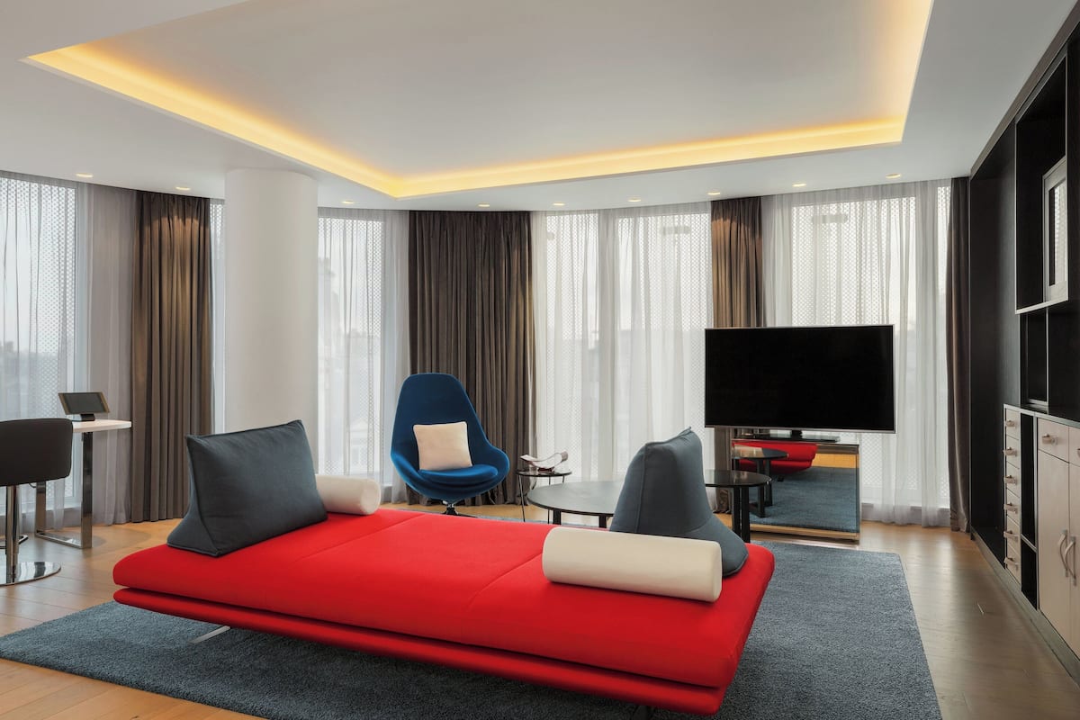Suite, 1 King Bed, Non Smoking, Corner | Living room | LCD TV, DVD player, iPod dock, pay movies