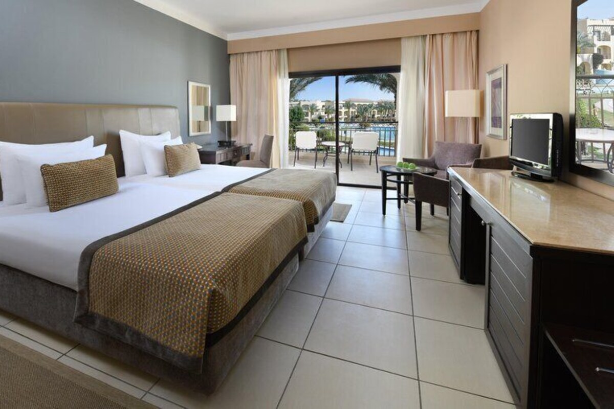 Superior Twin Room, Pool View | Minibar, in-room safe, blackout drapes, rollaway beds (free)