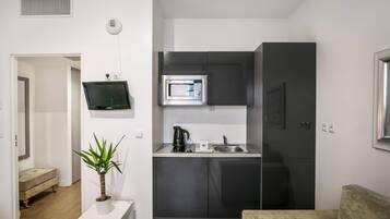 Apartamento, no fumadores | Cocina privada | Frigorífico pequeño, microondas, placa de cocina y hervidor eléctrico