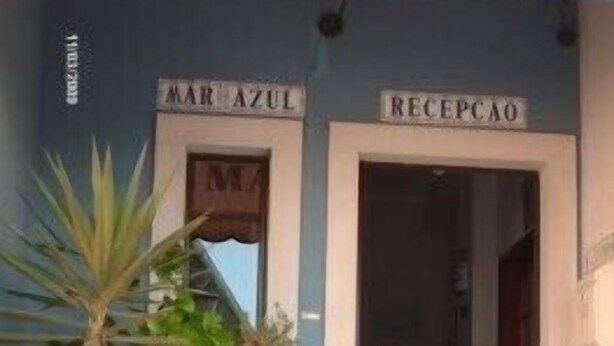 A building facade with a sign reading "MAR AZUL" and "RECEPCAO".