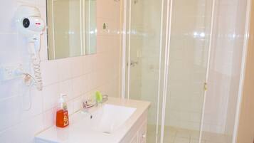 Bathtub, hair dryer, towels