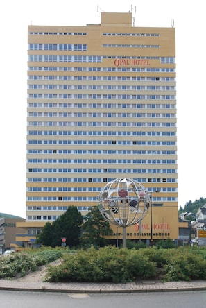 A hotel building with a sign reading "OPAL HOTEL" and a spherical sculpture in front. - Opal Hotel (Idar-Oberstein)