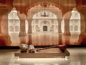 An interior view of a historic building with ornate arches and a central courtyard.