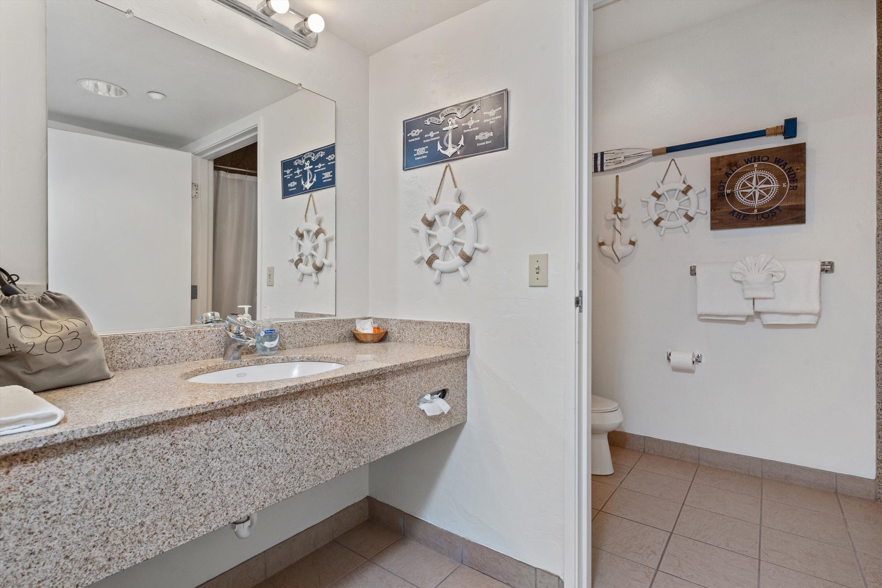 203 - pirates cove | bathroom | combined shower/bathtub, designer toiletries, hair dryer, towels