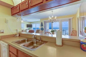 Full-size fridge, microwave, stovetop, dishwasher