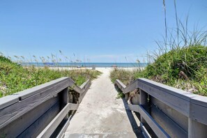 On the beach, surfing