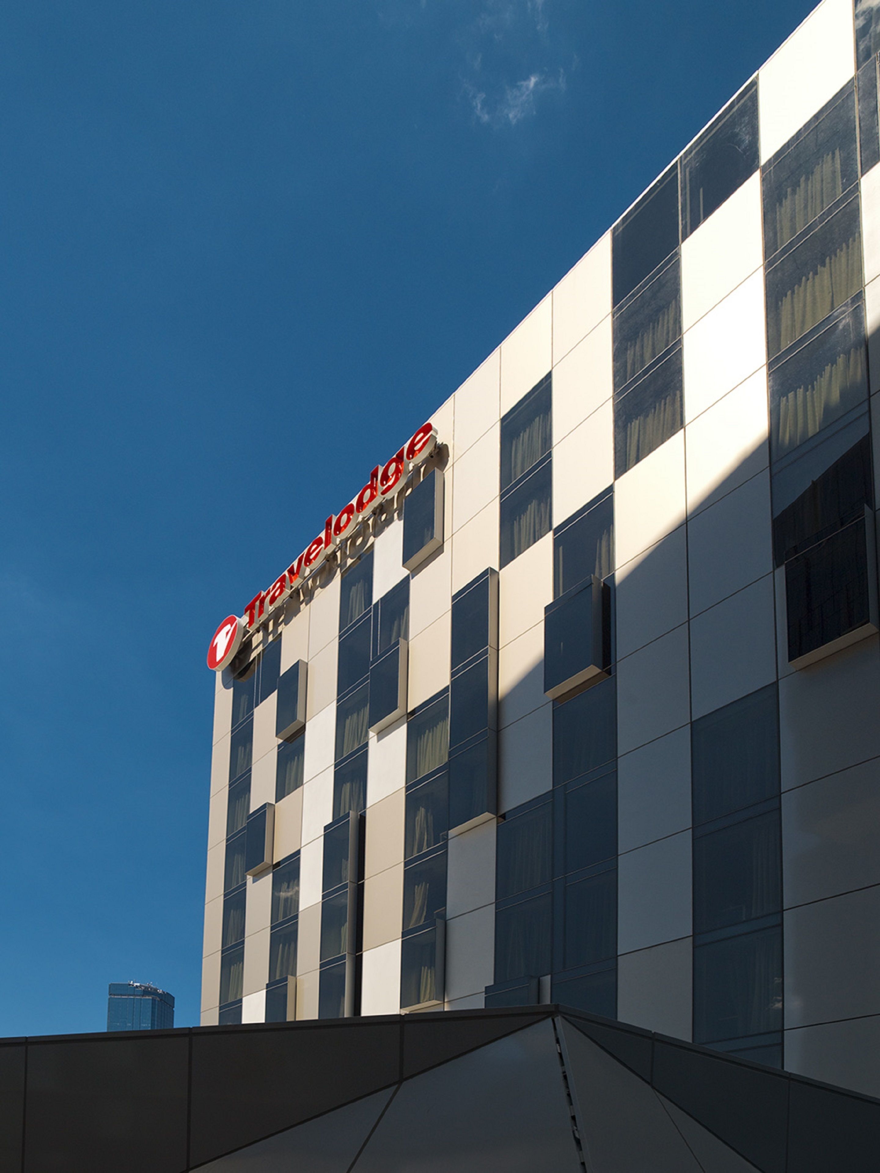 A modern building with a sign reading "Travelodge."