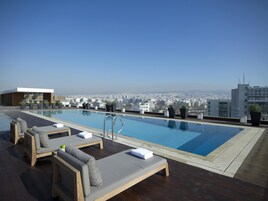Indoor pool, seasonal outdoor pool, pool umbrellas, pool loungers