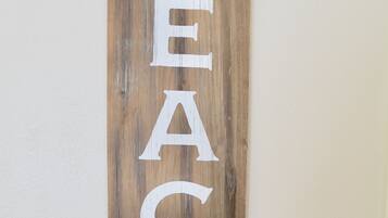 A wooden sign with the word "BEACH" and an arrow pointing to the right.