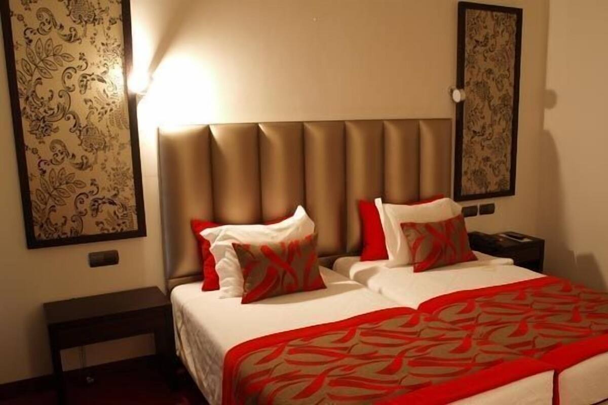 Family Quadruple Room | Minibar, in-room safe, desk, laptop workspace