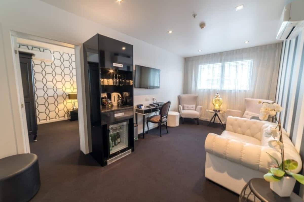 Executive Suite, 2 Bedrooms | Living area | LCD TV, DVD player