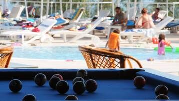 Seasonal outdoor pool, open 7:00 AM to 7:00 PM, pool umbrellas