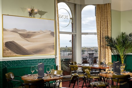 Breakfast and dinner served. The Palm Court Hotel