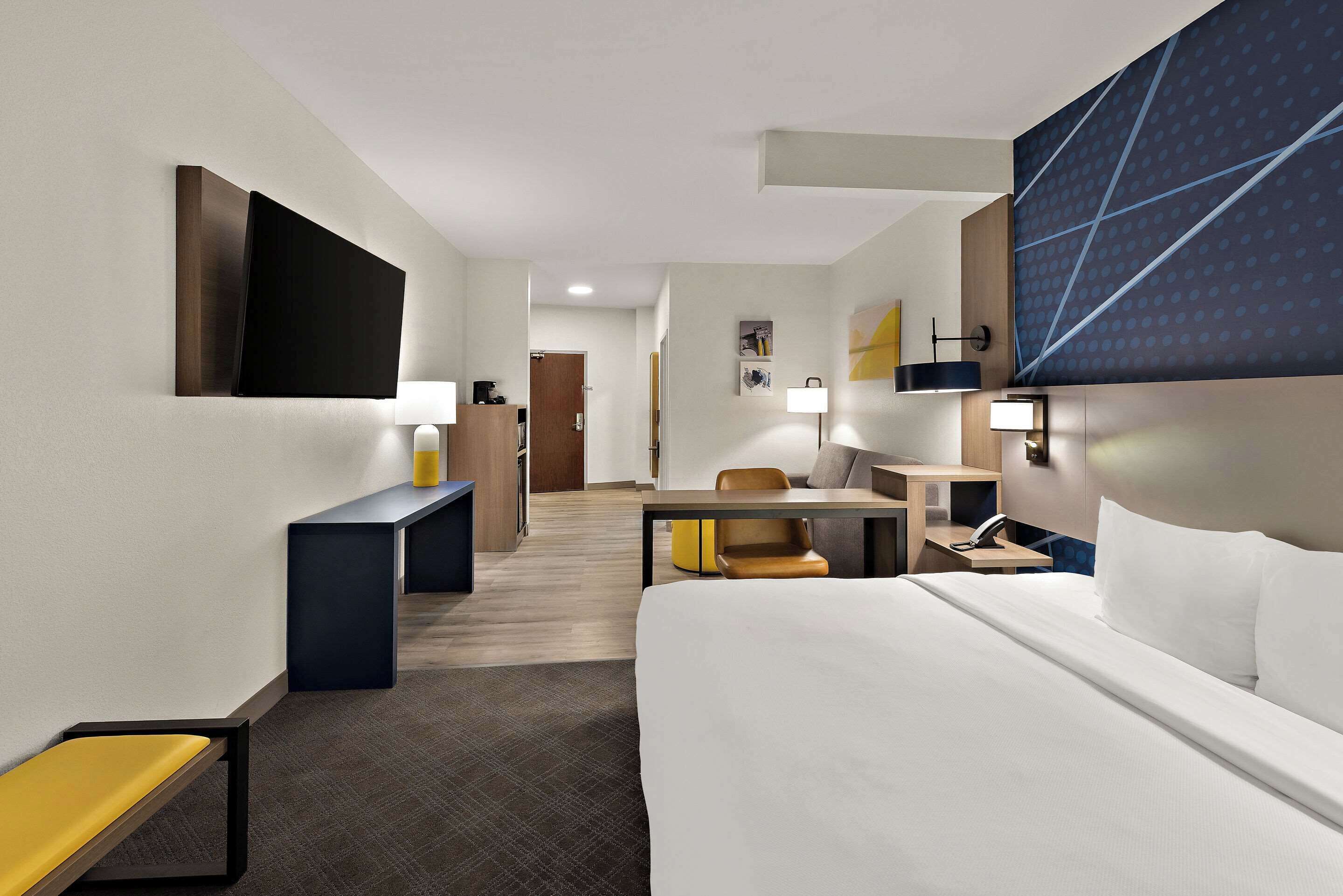 premium bedding, pillow-top beds, desk, laptop workspace